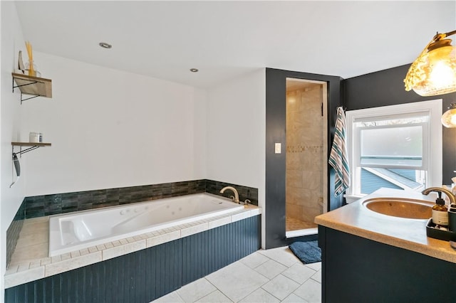 bathroom featuring a bath, a tile shower, vanity, and tile patterned floors