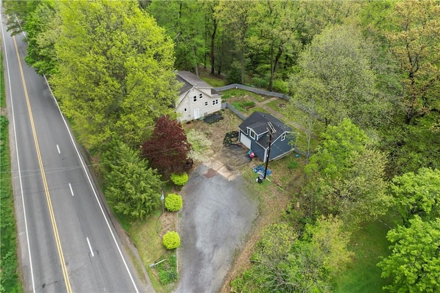 view from above of property featuring a heavily wooded area