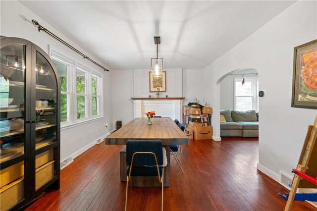 534 Freeport Rd, South Buffalo Twp, PA 16229 - dining area with arched walkways, dark wood-type flooring, and baseboards