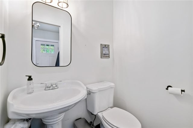 bathroom featuring toilet and a sink