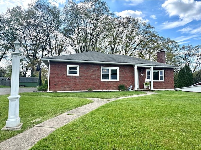 112 Dolphin Dr, Twp Of But Se, PA 16002 - ranch-style home featuring brick siding, a front lawn, and a chimney