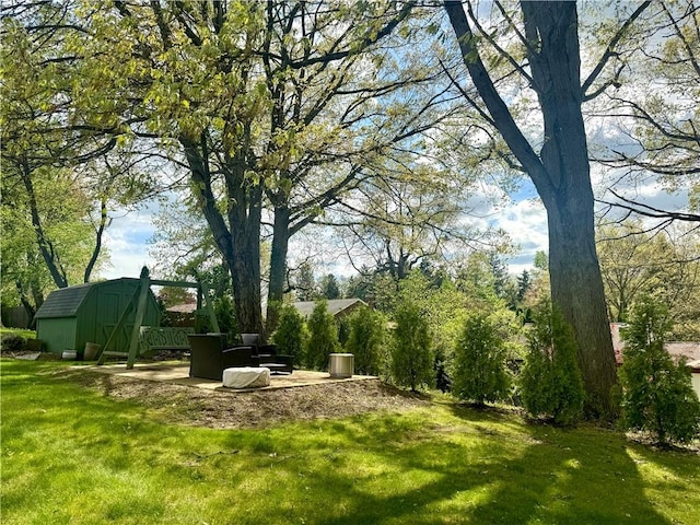 112 Dolphin Dr, Twp Of But Se, PA 16002 - view of green lawn with a storage unit and an outdoor structure