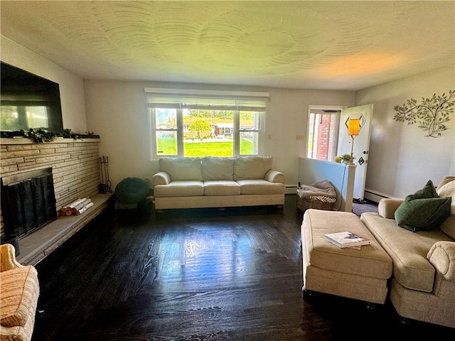 112 Dolphin Dr, Twp Of But Se, PA 16002 - living area with wood finished floors, baseboard heating, and a fireplace with raised hearth