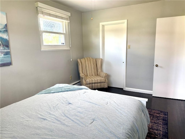 112 Dolphin Dr, Twp Of But Se, PA 16002 - bedroom with wood finished floors, baseboards, and a baseboard radiator