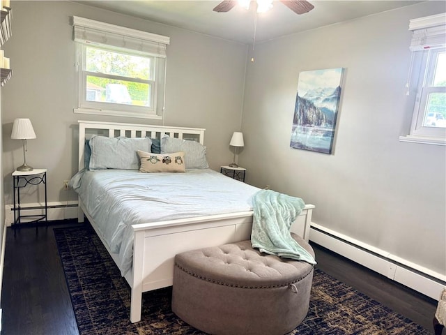 112 Dolphin Dr, Twp Of But Se, PA 16002 - bedroom featuring dark wood finished floors, baseboards, a baseboard heating unit, and baseboard heating