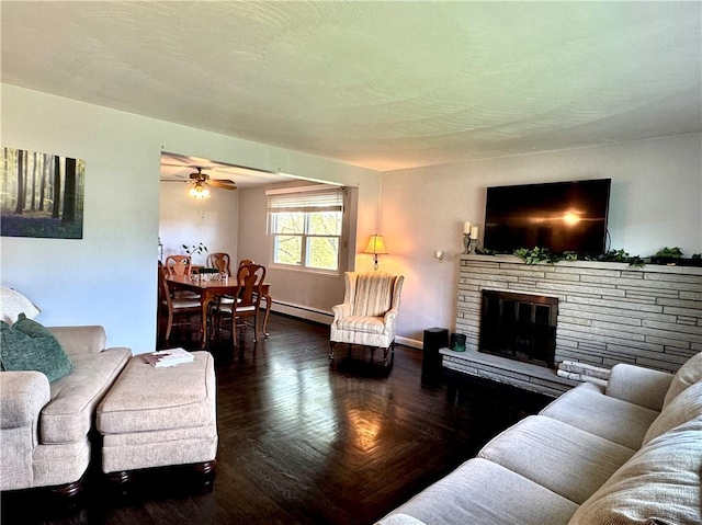 112 Dolphin Dr, Twp Of But Se, PA 16002 - living area with a baseboard radiator, a stone fireplace, a ceiling fan, and baseboards