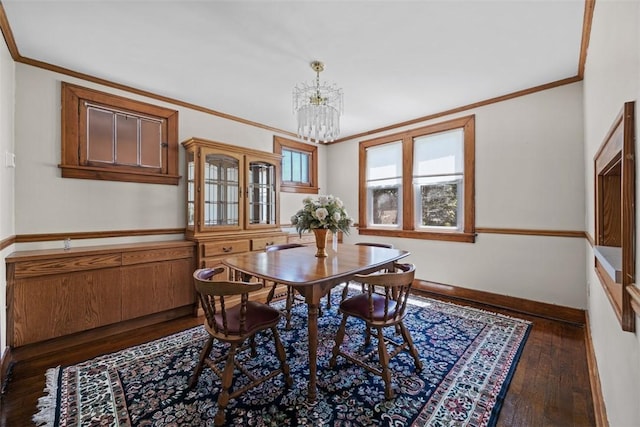 7208 Raymond St, Swissvale, PA 15218 - dining space featuring a chandelier, baseboards, hardwood / wood-style flooring, and crown molding