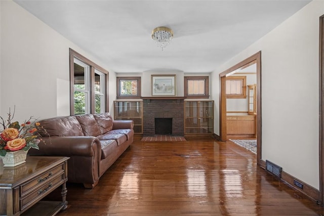 7208 Raymond St, Swissvale, PA 15218 - living room with hardwood / wood-style floors, a fireplace, and baseboards