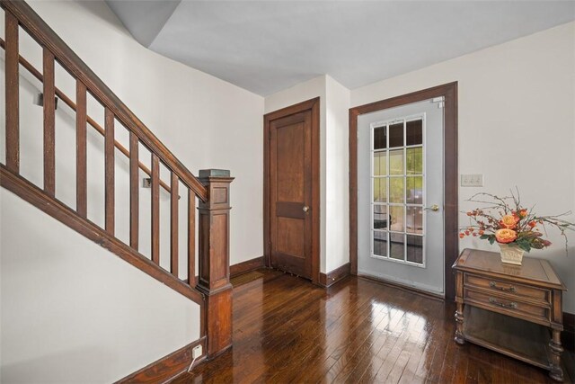 7208 Raymond St, Swissvale, PA 15218 - foyer featuring wood-type flooring, baseboards, and stairs