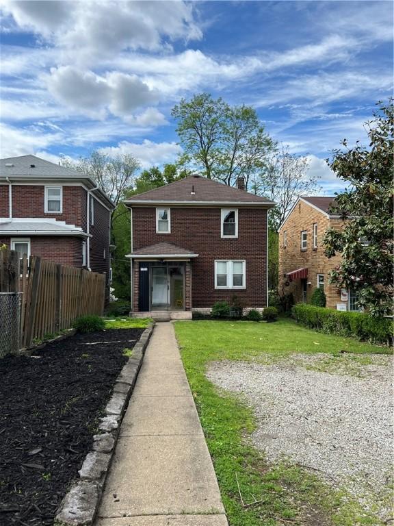 7208 Raymond St, Swissvale, PA 15218 - back of house with a chimney and brick siding