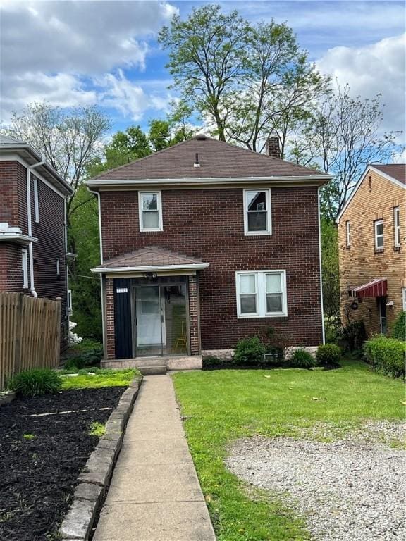 7208 Raymond St, Swissvale, PA 15218 - view of front of property featuring a chimney, brick siding, and roof with shingles