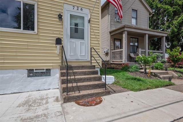 doorway to property featuring covered porch