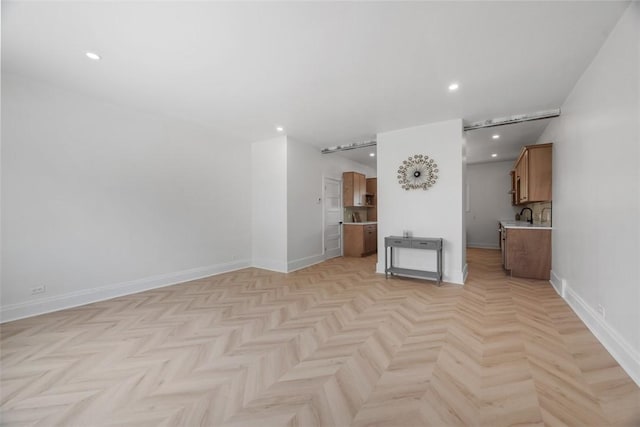 spare room featuring baseboards and recessed lighting
