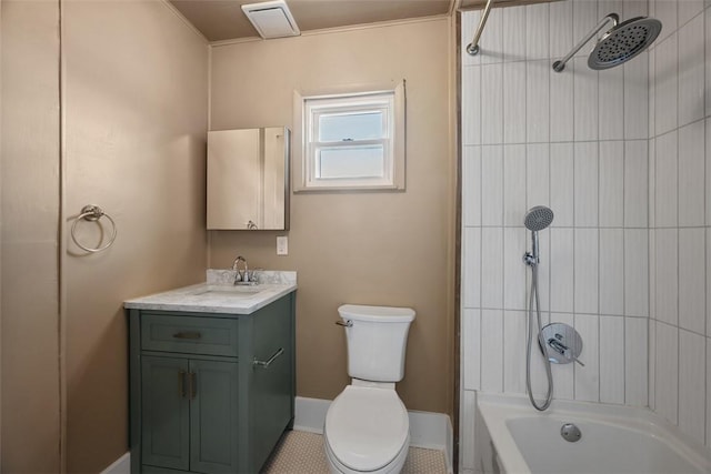bathroom featuring toilet, vanity, and bathtub / shower combination
