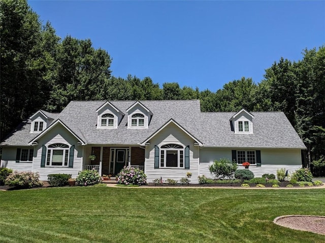 106 Arbor Trl, Slippery Rock Boro, PA 16057 - cape cod house featuring a front lawn, roof with shingles, and covered porch