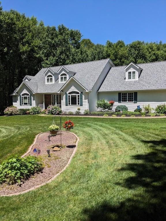 106 Arbor Trl, Slippery Rock Boro, PA 16057 - new england style home with a front yard and a shingled roof