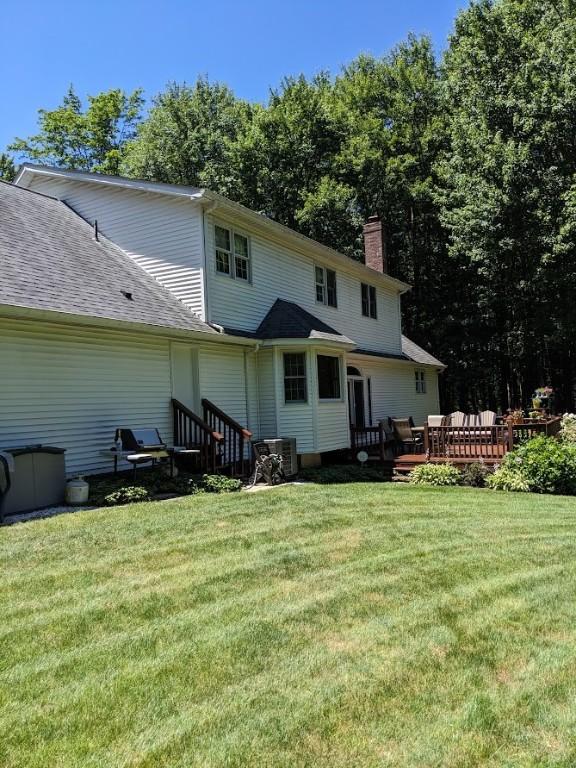 106 Arbor Trl, Slippery Rock Boro, PA 16057 - rear view of property with a chimney, a deck, and a lawn