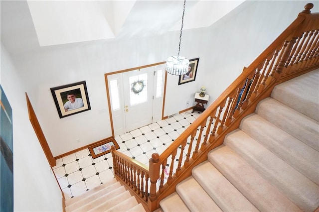 106 Arbor Trl, Slippery Rock Boro, PA 16057 - stairway with a chandelier, baseboards, and tile patterned floors