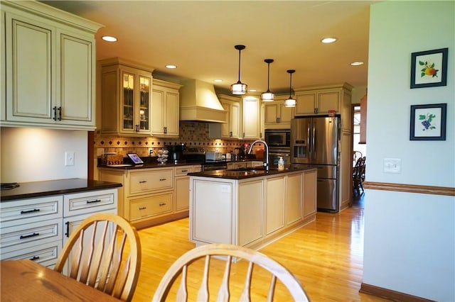106 Arbor Trl, Slippery Rock Boro, PA 16057 - kitchen with appliances with stainless steel finishes, custom range hood, a sink, dark countertops, and light wood-style floors