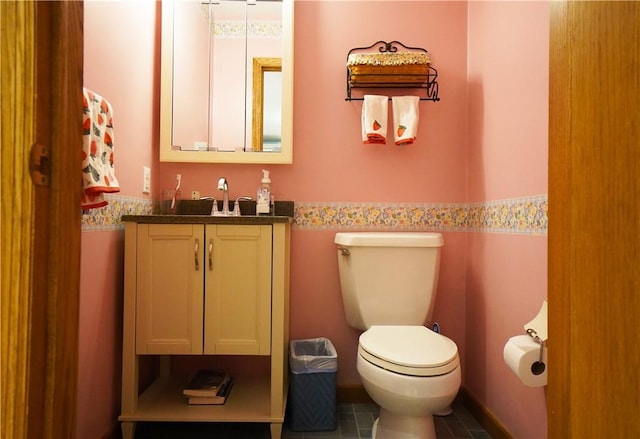 106 Arbor Trl, Slippery Rock Boro, PA 16057 - bathroom featuring toilet, vanity, and wainscoting
