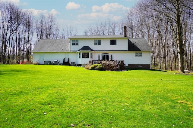 106 Arbor Trl, Slippery Rock Boro, PA 16057 - rear view of house featuring a chimney, a wooden deck, a yard, and crawl space