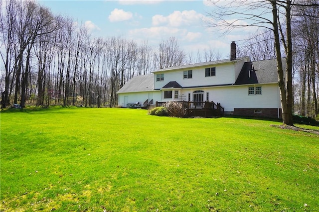 106 Arbor Trl, Slippery Rock Boro, PA 16057 - rear view of property featuring a chimney, a deck, and a yard