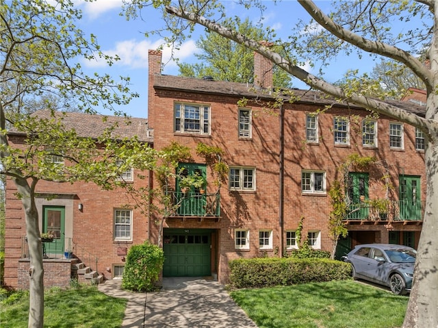 view of building exterior with a garage and driveway