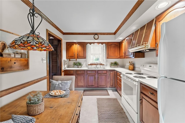kitchen with white appliances, premium range hood, a sink, crown molding, and brown cabinets