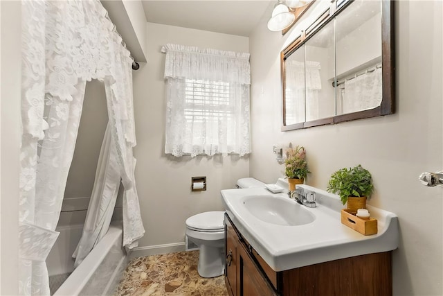 full bath with toilet, baseboards, vanity, and shower / tub combo with curtain