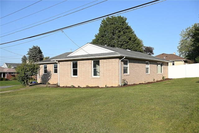 view of home's exterior with brick siding
