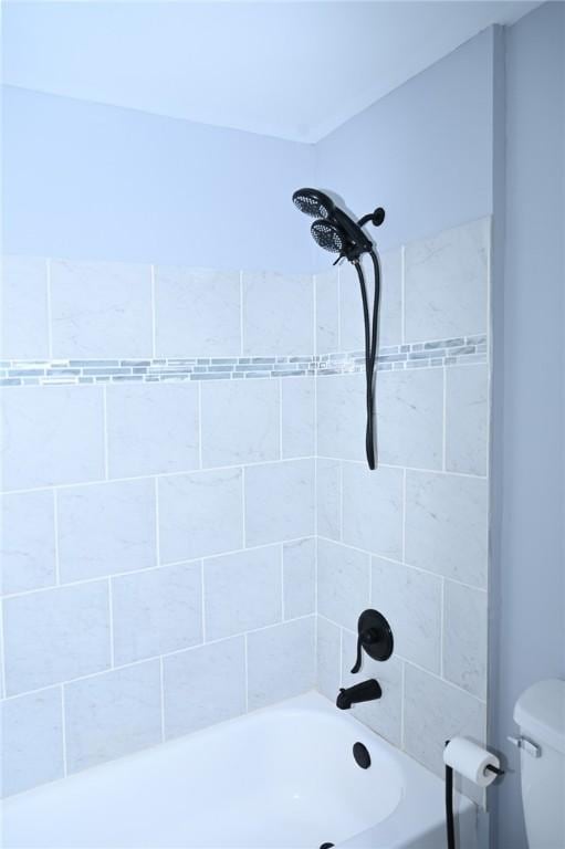 full bath with toilet and shower / bath combination