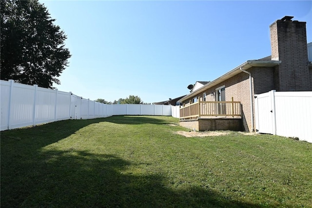 view of yard with a wooden deck