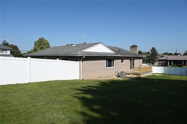 1301 Bechtel St, Monaca, PA 15061 - back of house featuring central air condition unit, a deck, a chimney, and brick siding