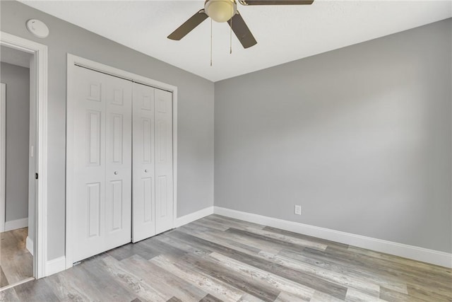 1301 Bechtel St, Monaca, PA 15061 - unfurnished bedroom with a closet, wood finished floors, and ceiling fan