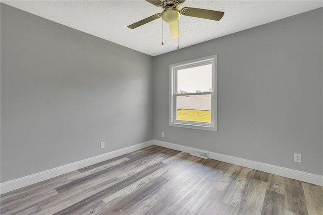 1301 Bechtel St, Monaca, PA 15061 - unfurnished room with wood finished floors and a ceiling fan