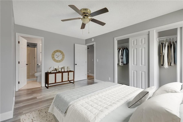 1301 Bechtel St, Monaca, PA 15061 - bedroom with light wood finished floors, a closet, ensuite bath, ceiling fan, and a textured ceiling