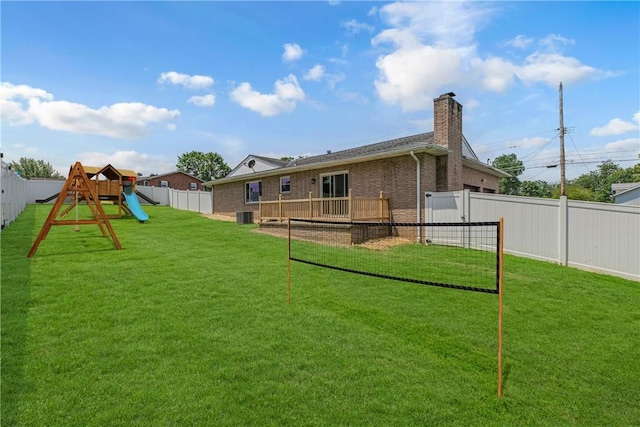 1301 Bechtel St, Monaca, PA 15061 - rear view of house with a fenced backyard, a chimney, brick siding, and a playground