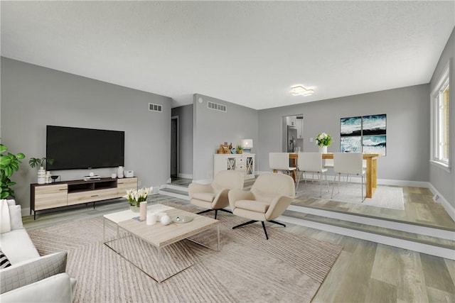 1301 Bechtel St, Monaca, PA 15061 - living area featuring wood finished floors and baseboards