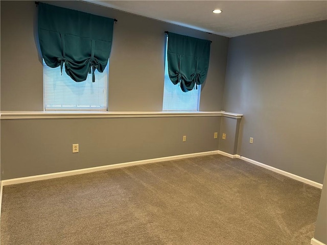 spare room with carpet, baseboards, and recessed lighting