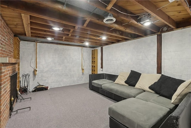 carpeted living area featuring a brick fireplace