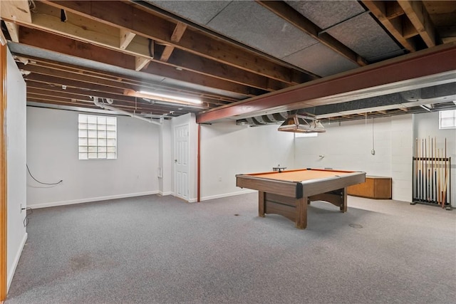 below grade area featuring plenty of natural light, carpet, billiards table, and baseboards