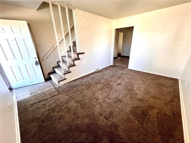 1244 Maple Ave, Monessen, PA 15062 - unfurnished room with dark carpet, stairway, and baseboards