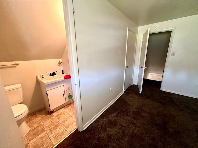 1244 Maple Ave, Monessen, PA 15062 - bathroom with lofted ceiling, toilet, and vanity