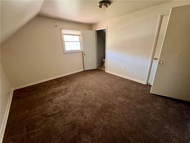 1244 Maple Ave, Monessen, PA 15062 - unfurnished bedroom with dark colored carpet, vaulted ceiling, and baseboards
