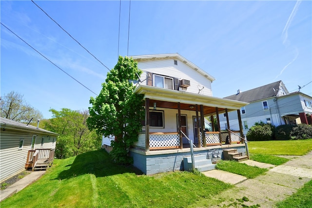 view of front of property featuring covered porch and a front lawn