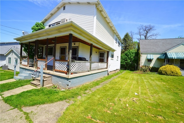 view of front of house with a porch, a front yard, and cooling unit