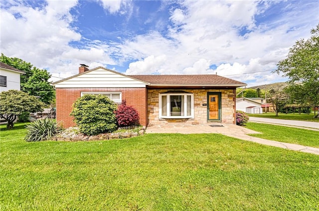 642 Washington St, Fairfield Twp, PA 15923 - view of front of home with a front yard, stone siding, and brick siding