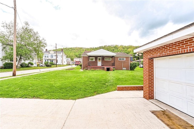 642 Washington St, Fairfield Twp, PA 15923 - view of green lawn with a garage and covered porch