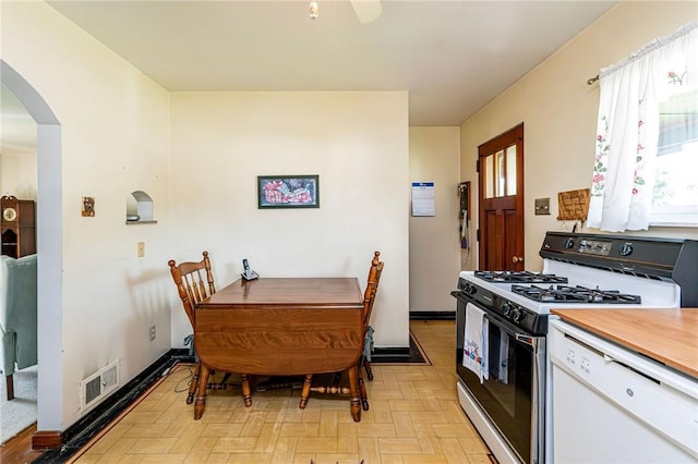 642 Washington St, Fairfield Twp, PA 15923 - kitchen with gas range, dishwasher, arched walkways, and healthy amount of natural light
