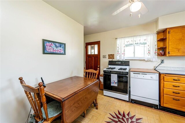 642 Washington St, Fairfield Twp, PA 15923 - kitchen with white dishwasher, range with gas cooktop, brown cabinets, ceiling fan, and open shelves